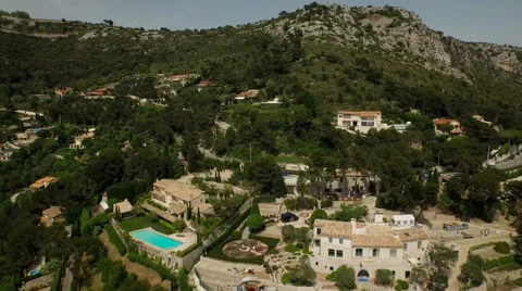 Eze Aerial over and up Eze mountainside Stock Footage 56134711