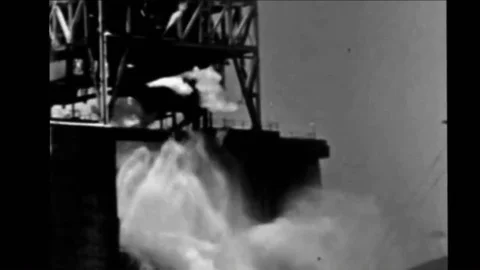 An F-1 gas-generator cycle rocket engine is tested on a stand at Edwards Air Stock Footage 92625327