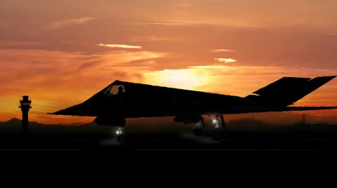 F-117a Nighthawk (stealth) fighter pulling onto tarmac Stock Footage