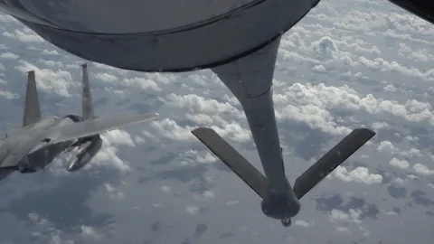 F-15 Eagle approaching boom of KC-135 for aerial refueling above Pacific Ocean Видео 103675882