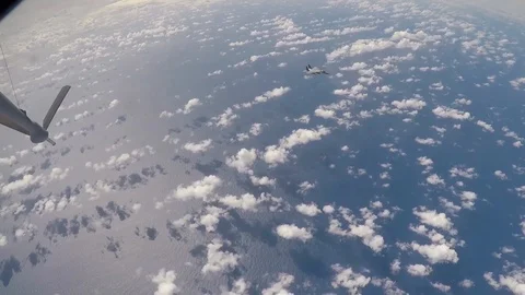 F-15 Eagle flies away from KC-135 on completion of aerial refueling Видео 103675941