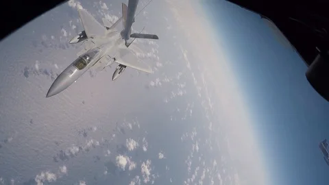 F-15 Eagle peels away from boom on completion of in-flight refuel above Pacific Stock Footage 103675970