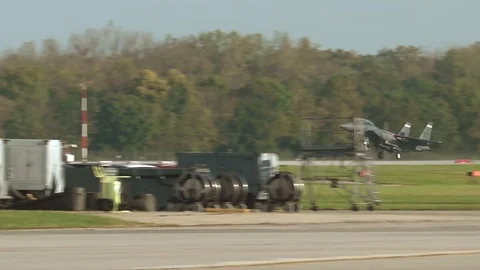 F-15E Strike Eagle coming in for a landing on a military base Stock Footage 112127486
