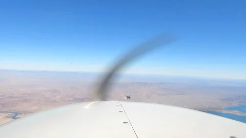 F-16 Fighting Falcon from Cessna light aircraft Stock Footage 263722384