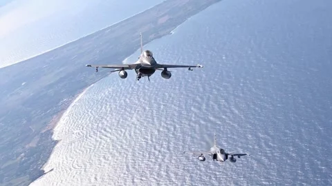 F-16 Fighting Falcon flying with SAAB JAS-39 Gripen above the coast of Greece Stock Footage 288320245