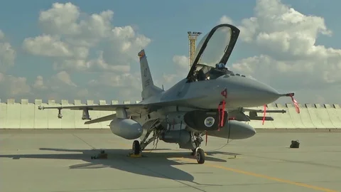 F-16 Fighting Falcon parked with canopy open and remove before flight tags Stock Footage 94699209