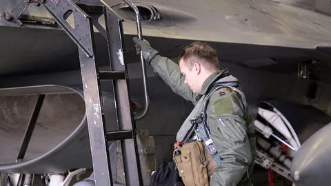 F-16 Fighting Falcon pilot climbing cockpit ladder Stock Footage 108434761