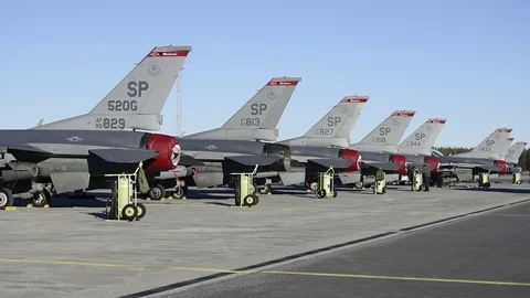 F-16 Fighting Falcon's parked with exhaust covers and remove before flight tags Stock Footage 97217146
