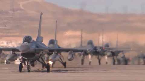 F-16 Fighting Falcons preparing to take off from air force base Stock Footage 114083884
