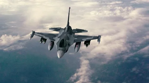 F-16 Flies over clouds Stock Footage 59554624