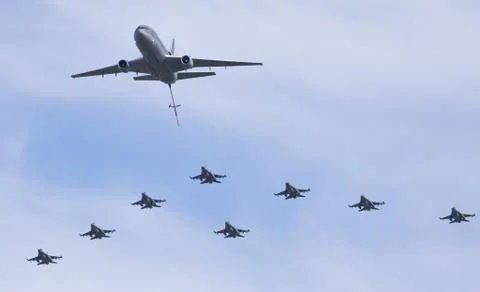 F-16 squadron flying in formation with a kdc-10 tanker Stock Photos