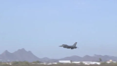 F-16 taking off and banking right with reheat Stock Footage 150362040