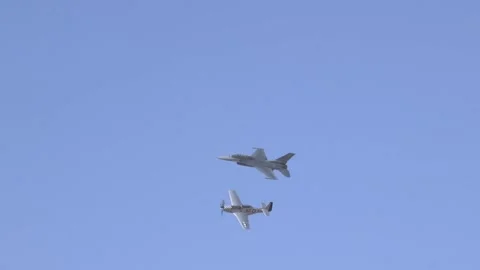 F-16 Viper and P-51 Mustang flying in tandem during Heritage Flight Stock Footage 150362030