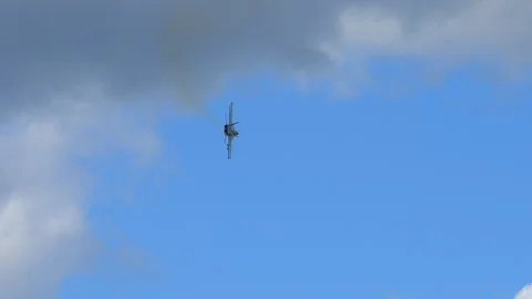 F-18 fighter jets flying under the clouds, showcasing military strength, speed Stock Footage 318049073