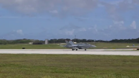 F/A-18 Hornet accelerating for take off at Andersen Air Base, Guam Stock-Footage 112327786