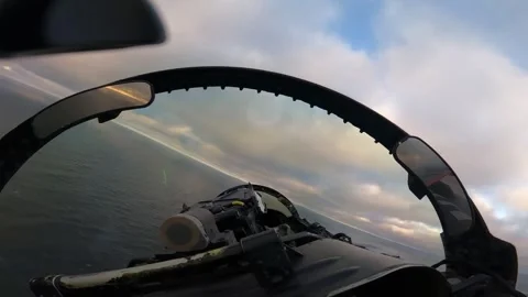 F/A-18 Hornet banking left over water from the cockpit Stock Footage 257078593
