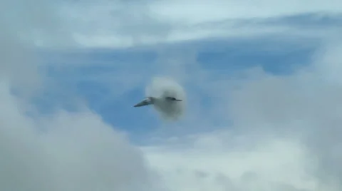 F-18 super hornet makes a high speed pass creating a vapor cone Stock Footage 51400705