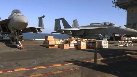 F/A-18E Super Hornets lowered on aircraft carrier Stock Footage 111848920