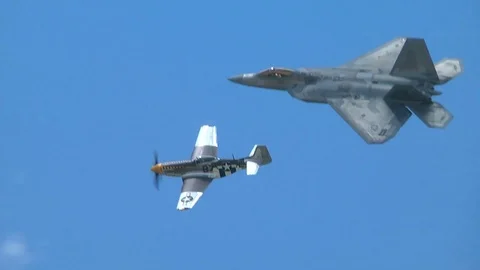 F-22 Raptor and P-51 Mustang flyby Stock Footage 91754879