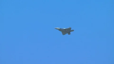 F-22 Raptor stealth fighter aircraft performs a slow roll Stock Footage 91755007