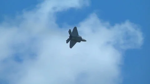 F-22 Raptor stealth fighter aircraft close pass then turn Stock Footage 91755064