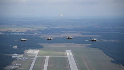 F-22 Raptors from 95th Fighter Squadron, 325 FW fly in formation in air - 2018 Stock Footage 100581353