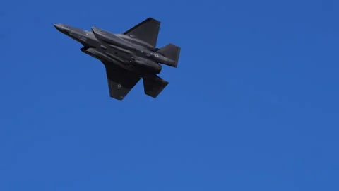 F-35 Fighter Jet Makes High-Speed Pass Followed by Banked Turn with Afterburner 스톡 동영상 296062630