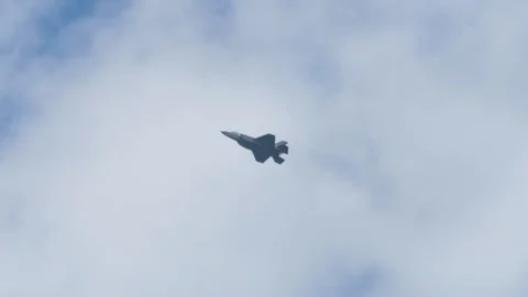 F-35 Fighter Jet Maneuvering Through Cloudy Skies Video stock 345085315