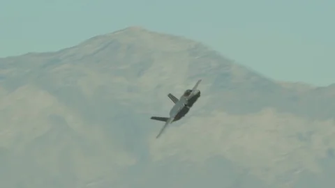 F-35A Lightning banking during flight above Utah Stock Footage 98628549
