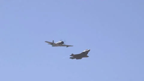 F-35A Lightning II and A-1 Skyraider fly side by side during HeriHeritage Flight Stock Footage 150362167