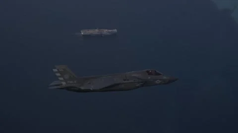 F-35B Lighting II flying above Royal Navy HMS Prince of Wales (R09) Stock Footage 259036383