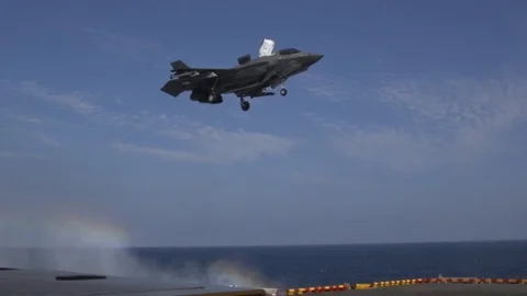 F-35B Lightning II hovering above USS Wasp during flight operations Stock Footage 102768957