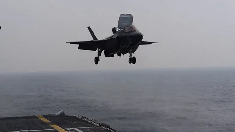 F-35B Lightning II hovering above flight deck of USS Wasp LHD-1 Stock Footage 105156686