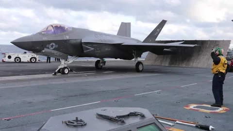 F-35C Lightning testing flaps infront of blast deflector USS George Washington Stock Footage 258898123