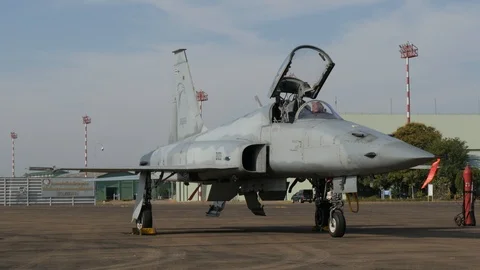 F-5 fighter plane with open cock-pit on airport,Ubon Ratchathani,Thailand Stock Footage 86817993