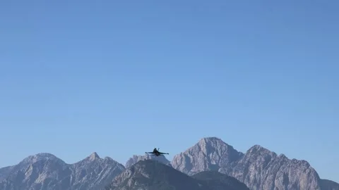 The F16 fighter performs aerobatics over the sea against the background of Stockbeeldmateriaal 308152070