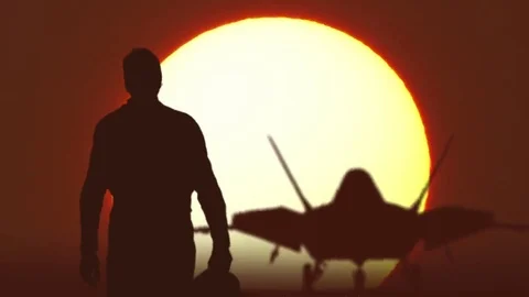 F22 fighter pilot walks against sunrise Vídeos de archivo 69111985