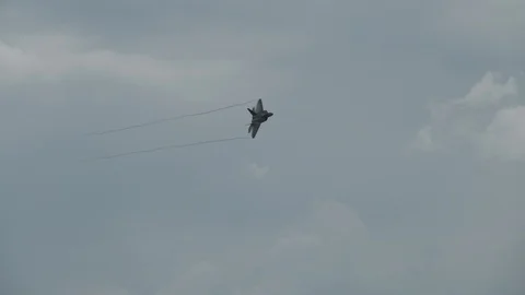 F22 raptor making a fast banking pass. Stock Footage 92768949