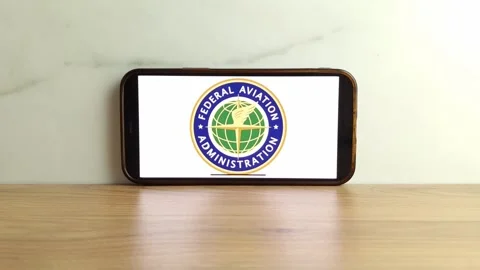FAA logo displayed on mobile phone Stock Footage 244080194