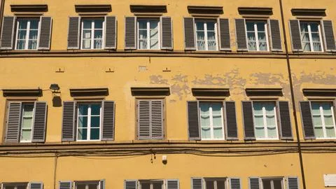 The faade of a typical old building in the city of Florence in Tuscany (Italy Stock Photos