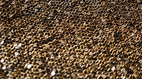 Fabric as background. 4k, slow motion, gold knitted fabric with paillettes Vidéo 81336913