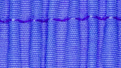 Fabric blue pressed, seam with threads close-up 스톡 동영상 243988029