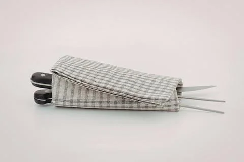 Fabric case for scissors and knitting needles 库存照片