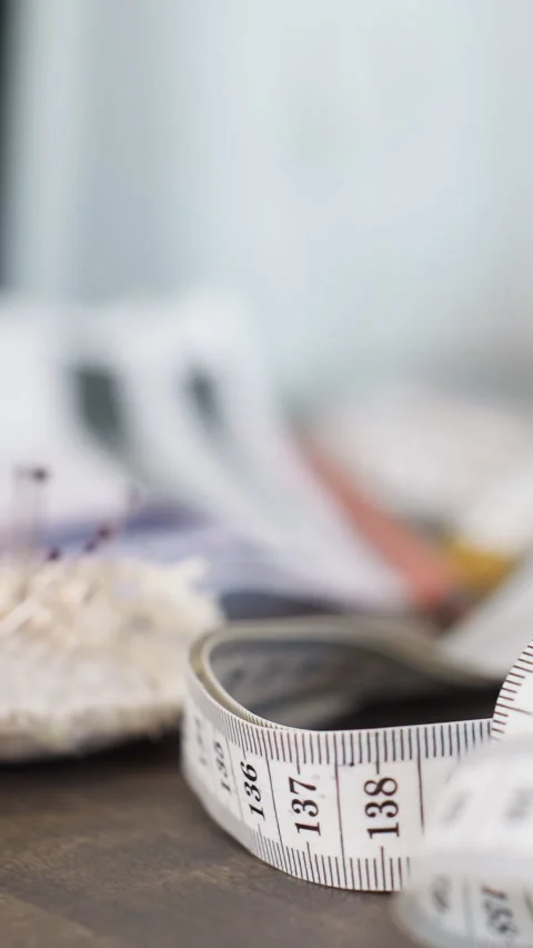 Fabric crafting scene, Sewing tools on craft table, Textile artisans using Stock Footage 323810627