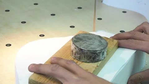 Fabric cutting in a factory using the machine Stock Footage 130828995