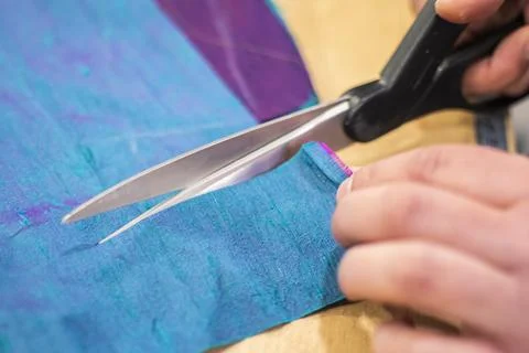 Fabric Cutting Process With Scissors In Tailoring Workshop Stock Photos