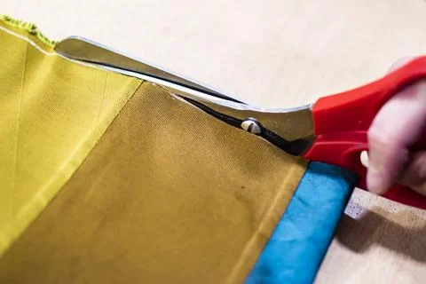 Fabric Cutting Process With Scissors In Tailoring Workshop Stock Photos