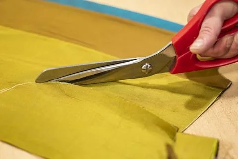 Fabric Cutting Process With Scissors In Tailoring Workshop Stock Photos