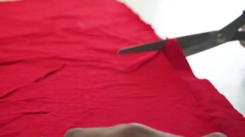 Fabric cutting with scissors red Stock-Footage 130827550