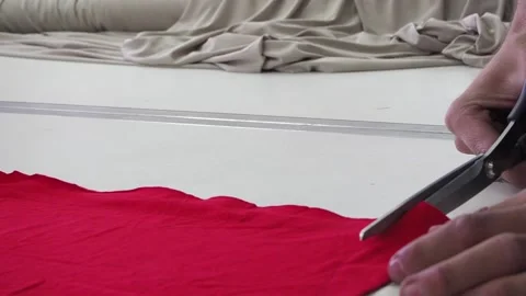 Fabric cutting with scissors red Stock Footage 130828734
